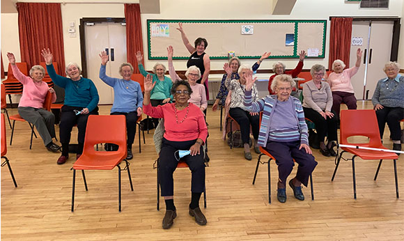 Tap dance fitness instructor in Paisley and Renfrewshire, seated Tapfit class.