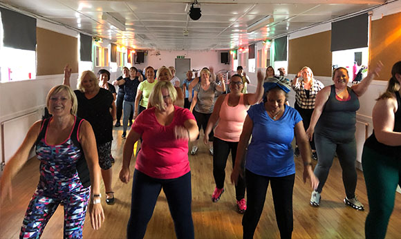 Tap dance fitness instructor in Paisley and Renfrewshire, group tapfit class in a community hall